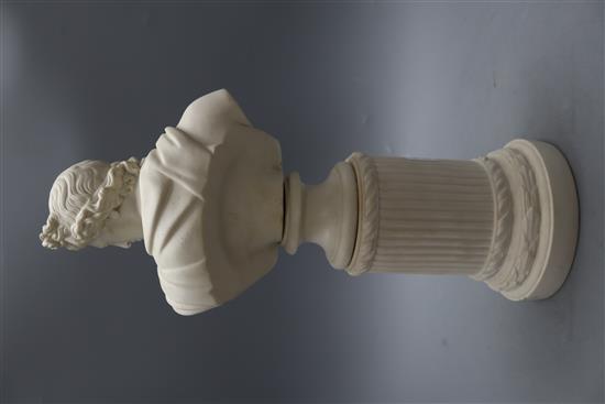 After the Antique, a parian bust of the Apollo Belvedere, on a pillar, height 50cm